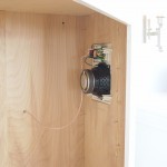 Left and right front speakers on either side of cabinet